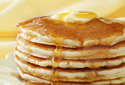 Stack of pancakes with a pat of butter on top